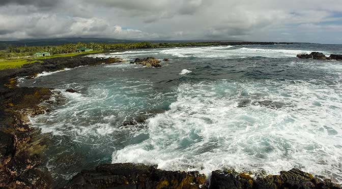 waves at black sand beach near kona