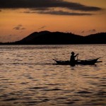 fisherman and boat silhouette, philippines